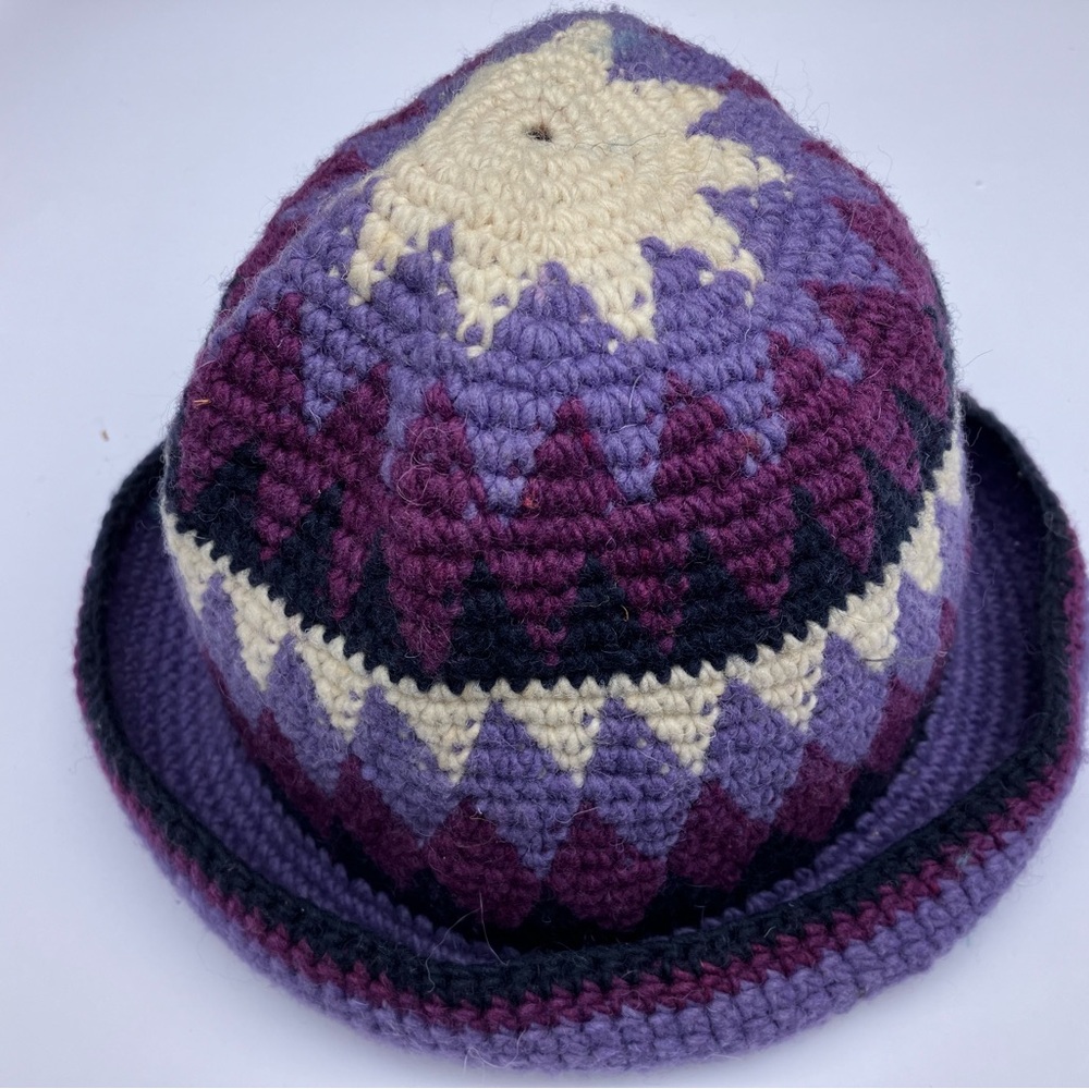 Purple hand crocheted rolled brimmed wool hat made in Peru. One size.